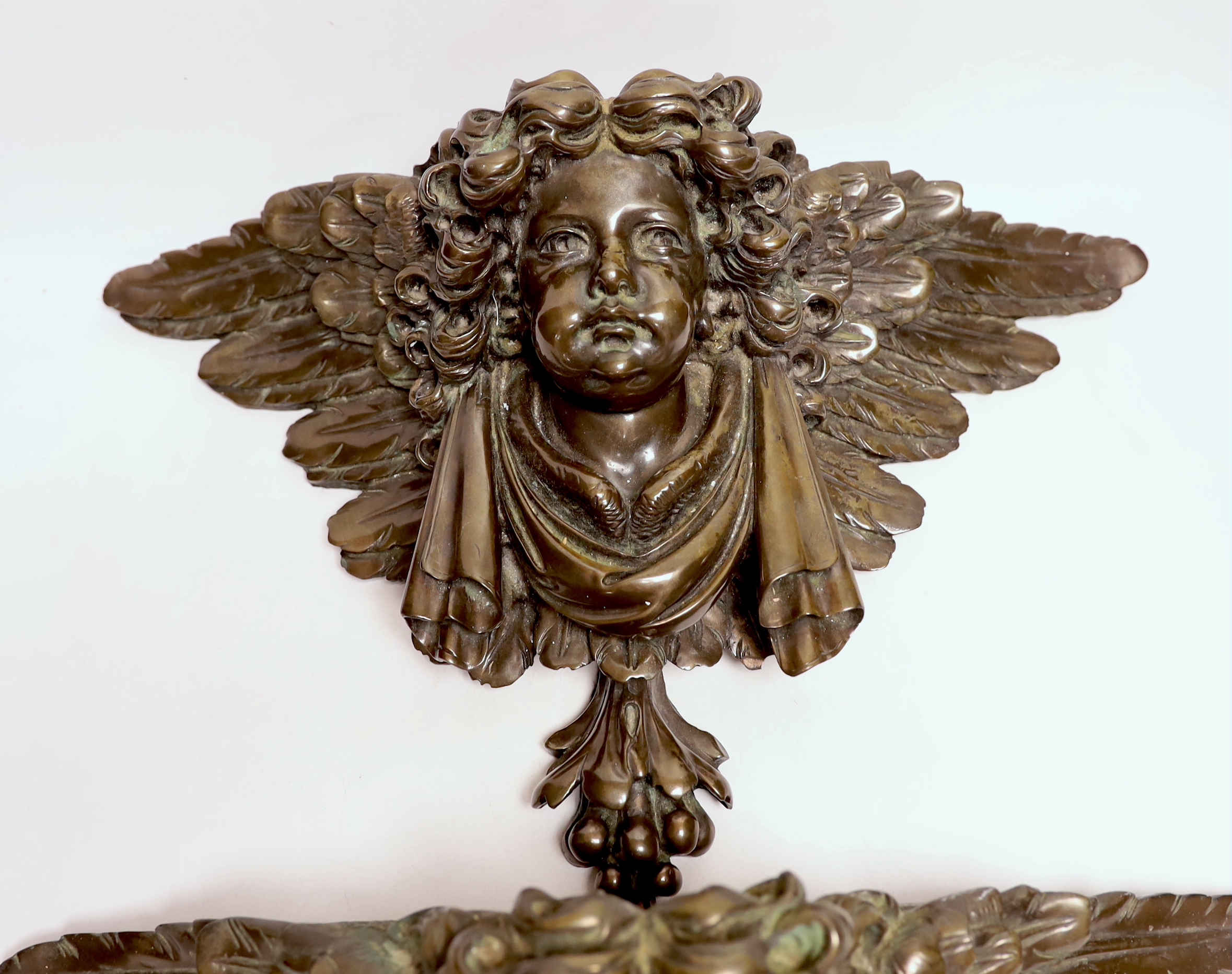 A pair of resin cherub brackets 'bronzed', 29 x 47cm
